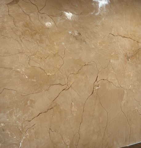 Venetian plaster accent wall finished — gold marble sheen